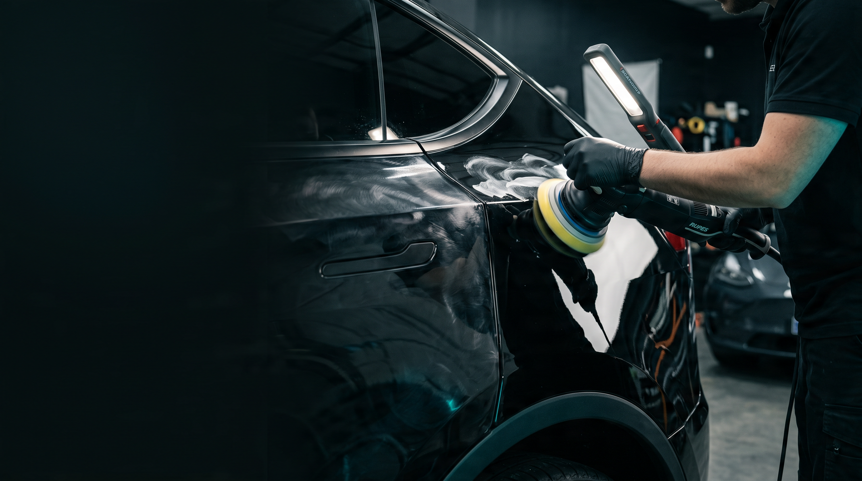 Polisher cutting defects out of gloss-black paint